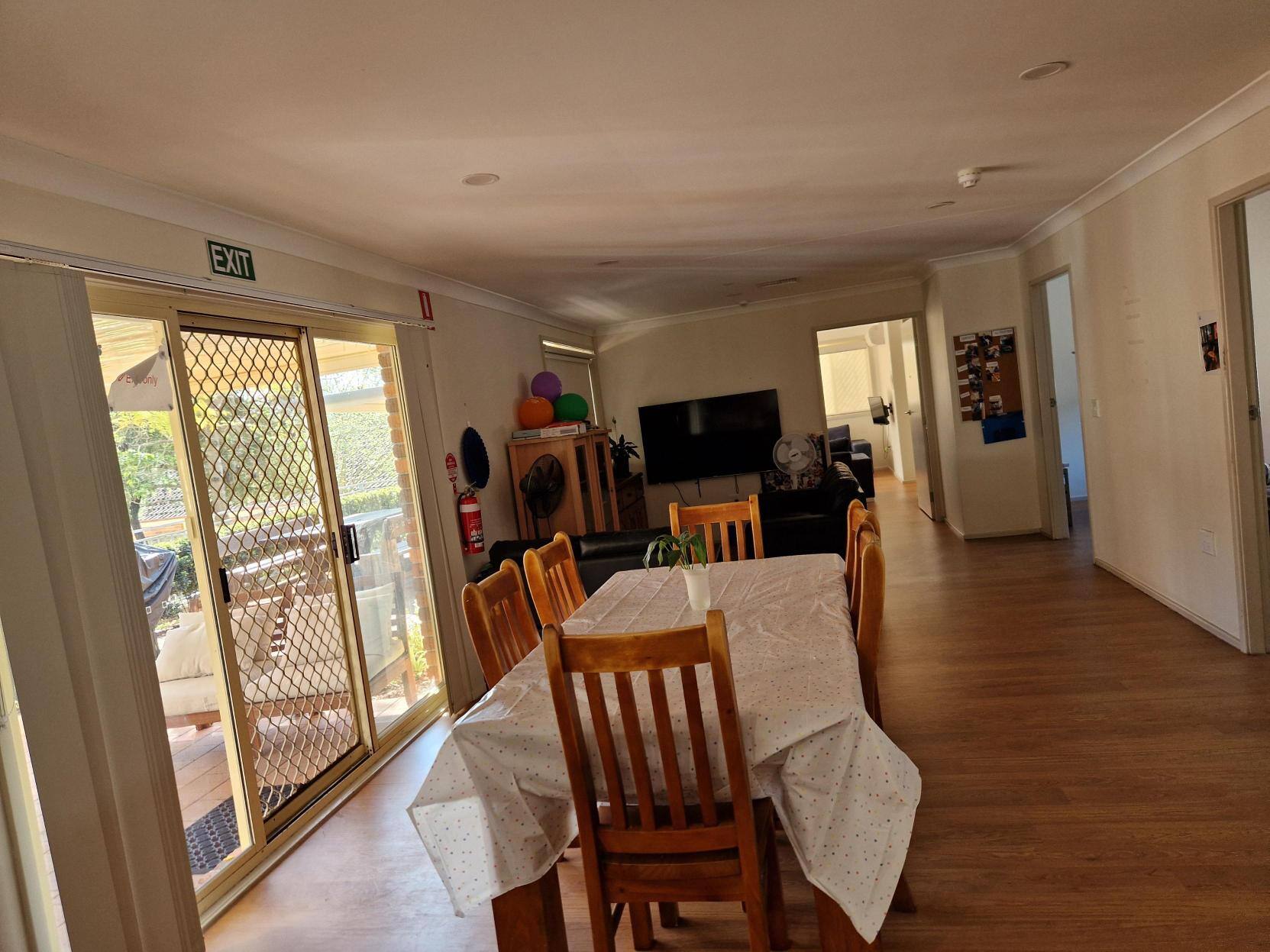 Dining room table with a white tablecloth.