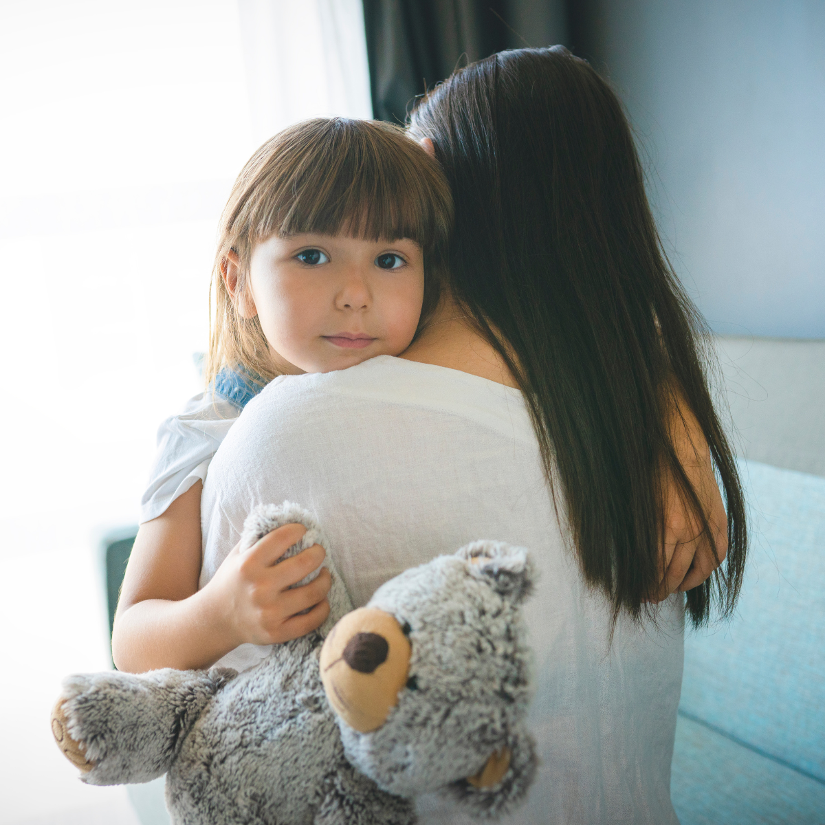 Foster Care | Landing Page | Woman Holding Little Girl Holding a Teddy Bear - Respite Care