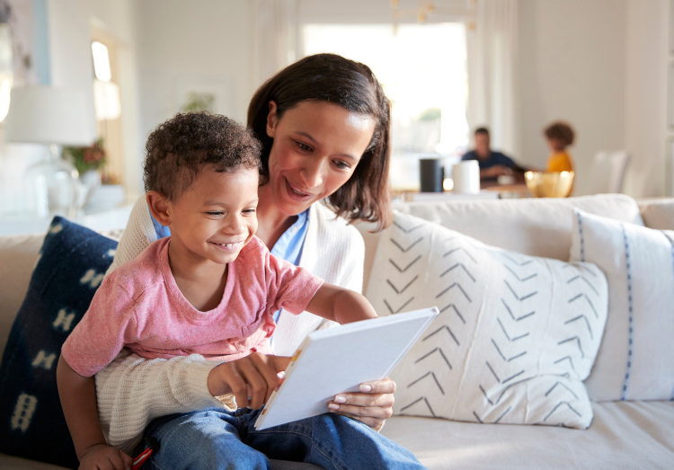 Foster Care | Landing Page | Woman Reading Something To Child - Can I be A Foster Carer