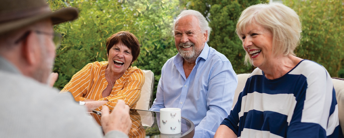 Smiling seniors enjoying a moment together at the Retirement Living Open Day in Sylvania.