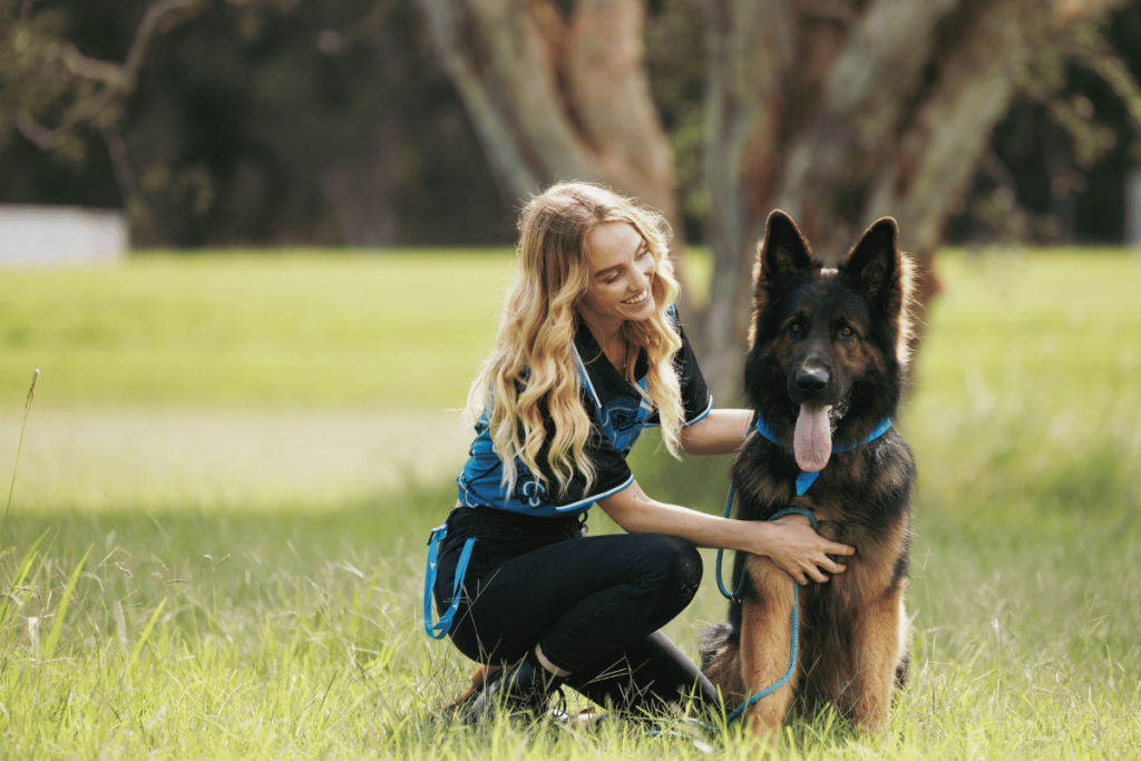 Emily and a dog, emblematic of the support for homeless youth provided by Wesley Mission.